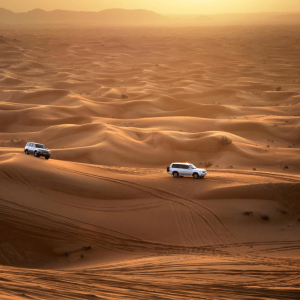 Abu Dhabi Sunset Desert Safari with BBQ, Camel Ride & Sandboarding – Experiences Kanwal Malik Official a poet, novelist and a writer based in dubai